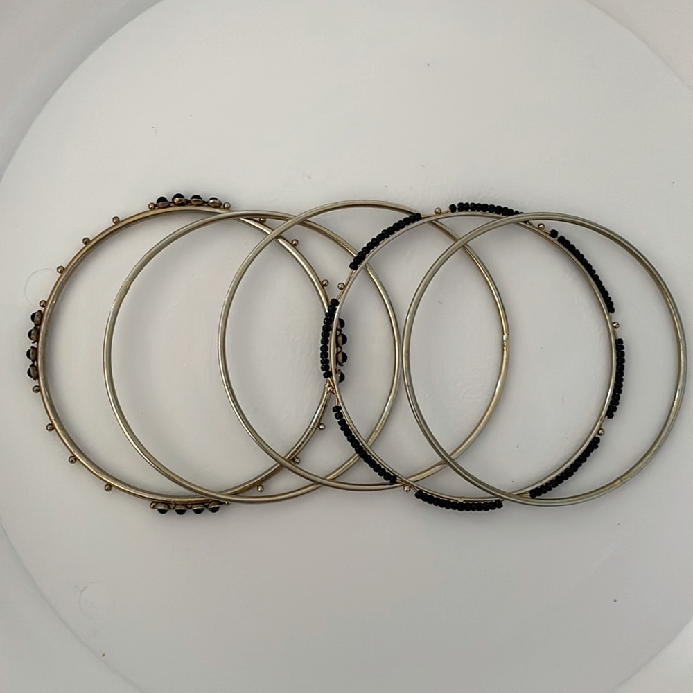 Set of gold and black bangles